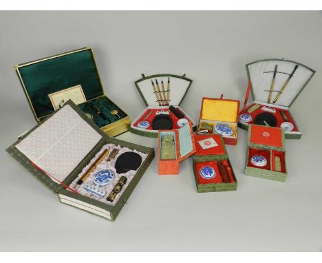 A collection of Chinese calligraphic implements, late 20th Century, including jade seals, brushes, ink stones, brush rests, s