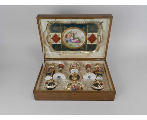 A Vienna porcelain dressing table set early 20th century typically decorated with vignettes and alternating coloured panels a