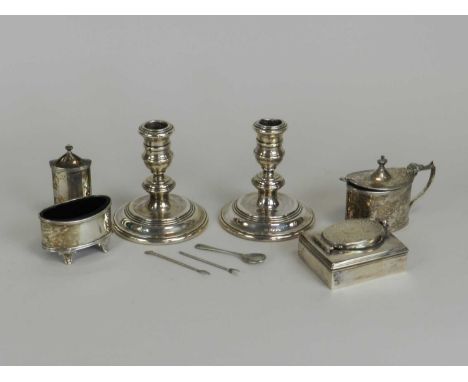 A pair of silver mounted candlesticks, London 1962, 11cm high (loaded), together with a silver travelling inkwell, marks rubb