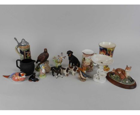 A mixed collection of ceramics to include four Beswick dogs, Beswick bird, Royal Crown Derby imari paperweight, German stein,