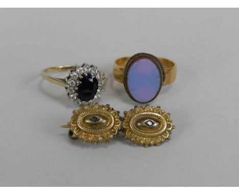 A yellow metal band, mounted with hardstone plaque (not stamped), together with 9ct gold oval cluster ring and a yellow metal