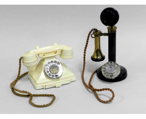 A GPO model 150 'candlestick' rotary telephone and a cream coloured model 232 'pyramid' telephone. (2)