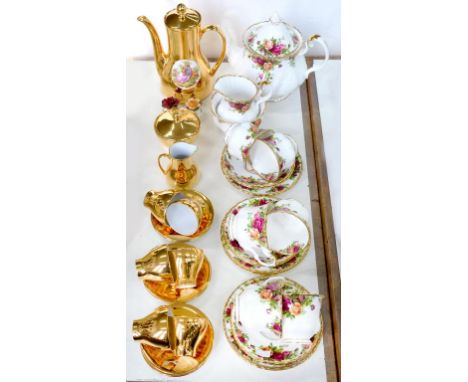 A ROYAL ALBERT OLD COUNTRY ROSES PATTERN TEA SERVICE AND A GERMAN GILT GROUND COFFEE SERVICE