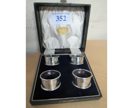  Sale Item:    CASED SET 4 SILVER NAPKIN RINGS   Vat Status:   No Vat   Buyers Premium:  This lot is subject to a Buyers Prem