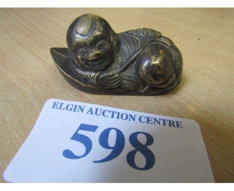  Sale Item:    ORIENTAL BRASS RECLINING FIGURE   Vat Status:   No Vat   Buyers Premium:  This lot is subject to a Buyers Prem