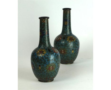 A pair of Chinese cloisonné bottle vases, 19th Century 
The elongated globular body, rising to a tapered neck and flat rim, a