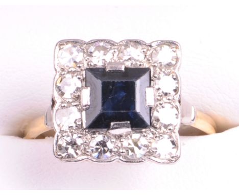 A circa 1930's sapphire and diamond square cluster ring
The central square step cut sapphire of approx. 6x6mm, four claw set 