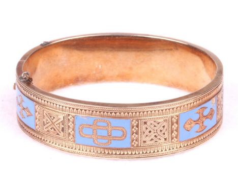 A gold and enamelled hinged bangle, circa 1870-1890
With Celtic type plaque decoration, alternate plaques highlighted with pa