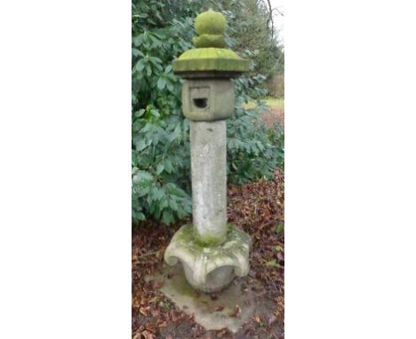 A showa period Japanese carved stone sectional lantern (Ishidoro)
With carved stone base (kiso), plain shaft (sao), light box