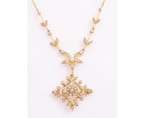 A gold split pearl set pendant necklace, early 20th Century
The lower section being a split pearl set floral burst, with deta