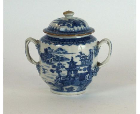 A Chinese blue and white Export porcelain lidded pot, Circa 1770
Of Gaiwan form, the bulbous ridged body, applied with twin s