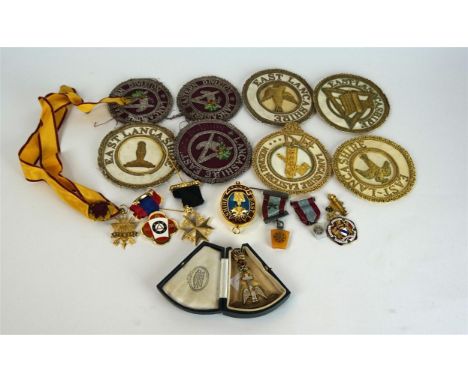 A Masonic silver gilt and enamel past masters jewel
By G. Kenning & Son, decorated with a red enamel rose, a red enamel cross