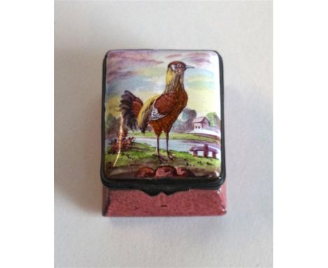 A Georgian enamel pill box
The hinged lid decorated with a standing cockerel with a landscape, with metal hinges and rim, abo