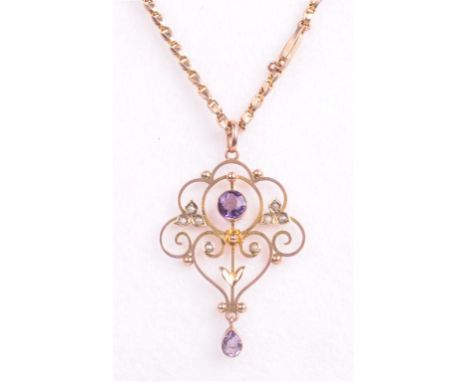 An amethyst and seed pearl set 9ct gold pendant and chain, early 20th Century
The pendant set with a central round cut amethy
