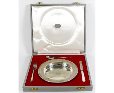A matched hallmarked silver christening set
Comprising circular baby's plate, made by Wakely & Wheeler London 1961, knife wit