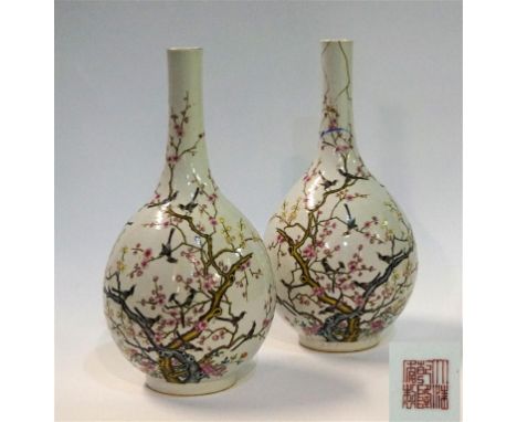 A pair of Chinese famille rose bottle vases, Iron-red Qianlong seal mark, probably Hongxian Period
Each of the rounded bulbou