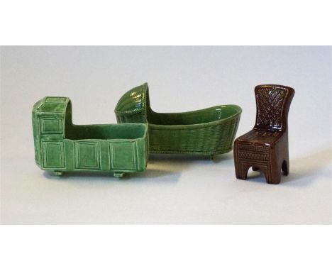 Two English earthenware children's miniature cribs, 19th Century  
To include two green glazed cribs, one having basket weave