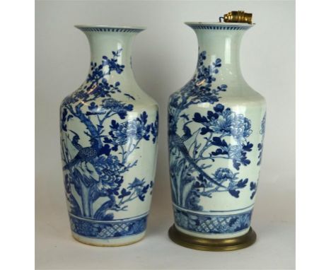 A pair of Chinese blue and white baluster vases, 19th Century
Of slender tapered form rising to a flared rim, decorated in th