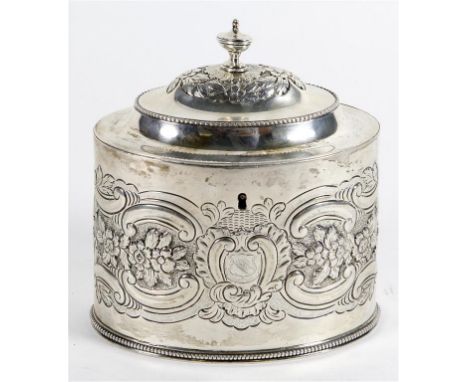 A Victorian hallmarked silver tea caddy
Of oval form, repousse decorated with scrolls and foliate surrounding a cartouche hav