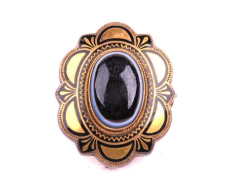 A mid Victorian banded agate mourning brooch
The central oval cabochon banded agate within a gold and black enamel border. Wi
