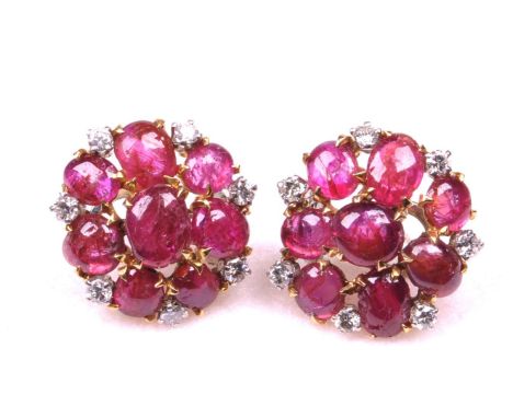 A pair of Burmese ruby and diamond set earrings
Each set with eight oval cabochon rubies to round brilliant cut diamond highl