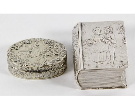 Two Continental white metal snuff boxes
The first of rectangular proportions in the form of a book, repousse decorated with f