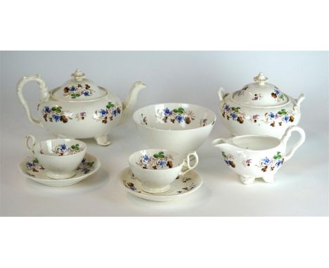 A hand painted 19th Century tea service
Comprising teapot, twin handled lidded sugar bowl, slop bowl, milk jug, eighteen vari