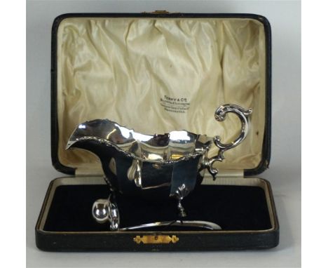 A George V hallmarked silver sauce boat
Having cast scrolling rim, raised on three hoof feet, with earlier hallmarked silver 