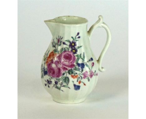 An 18th Century Worcester hand painted sparrow beak jug  
Of baluster form, hand painted with roses and foliate on an ivory g