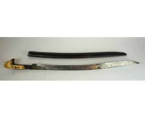 A Turkish Yataghan sword, mid 19th Century
The 57cm blade with white metal with white metal inlaid decoration of flowers and 