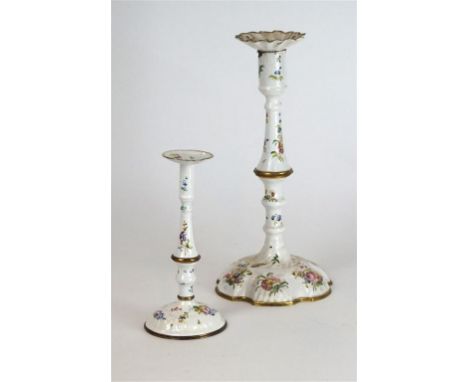 Two 18th Century Bilston enamel candlesticks, circa 1760
The larger with detachable drip pan, knopped stem and dome wavy edge