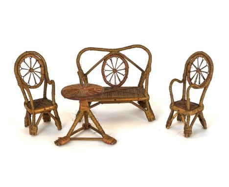 A dolls house conservatory suite, early 20th Century
The settee, two armchairs and table constructed of bamboo and soft wood 