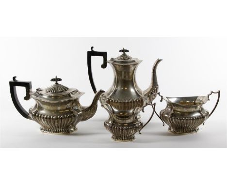 An Edward VI hallmarked silver four piece tea service
Of shaped oval form, comprising teapot, coffee pot, twin handled sugar 