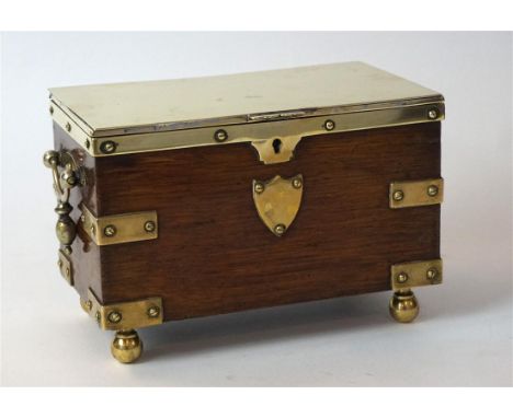 A good quality Victorian brass mounted oak tea caddy
The hinged lid enclosing a lined and partitioned interior, flanked on ei