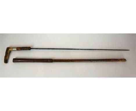 A sword stick, mid 19th Century
The 70cm double edged blade with acid etched decoration and traces of bluing, with bamboo gri
