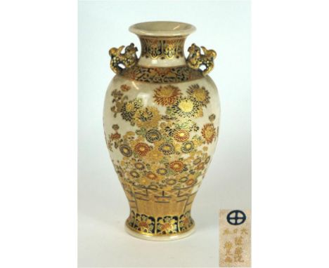 A Japanese Satsuma earthenware vase, Meiji/Taisho Period
The vase of baluster form, flanked by twin relief moulded shishi dra