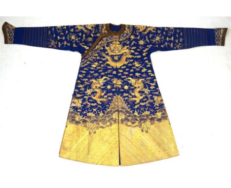 A Chinese blue ground kesi type 'Six' dragon court type robe, 20th Century 
The rich blue colour heavily embroidered in gilt 