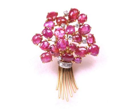 A Burmese ruby and diamond set spray brooch
Set with twenty-two oval cabochon rubies, to round brilliant diamond highlights. 
