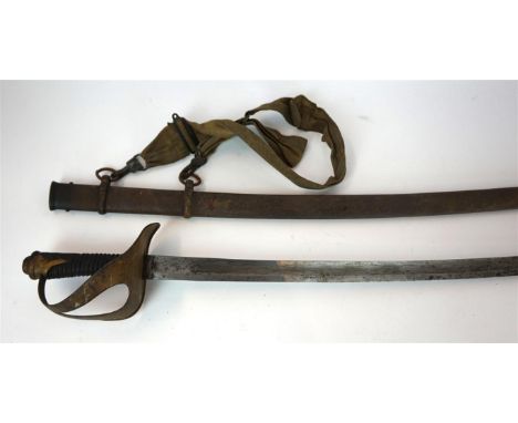 A Cavalry sword, possibly Italian, late 19th Century
The 89cm curved single edged, single fullered blade stamped W&C, with pi