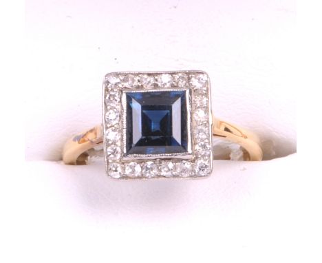 A circa 1930's sapphire and diamond dress ring
The central square step cut sapphire of approx. 6x6mm collet set to a border o