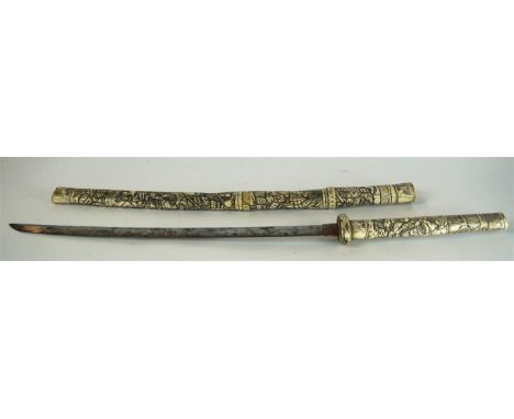 A Japanese bone mounted Wakazashi, (Late Meiji Period 1868-1912)
The earlier re-mounted folded steel curved single edged blad