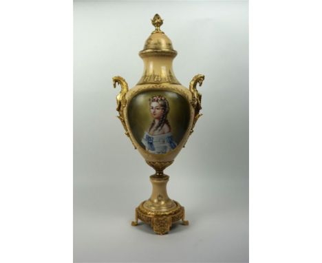 A reproduction ceramic and gilt metal mounted temple jar and cover
Hand painted with two portraits of women wearing tradition