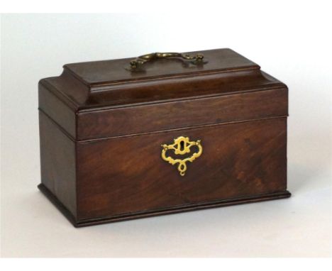 A George III mahogany tea caddy, circa 1775
The hinged concave lid fitted with shaped brass handle, enclosing a three partiti