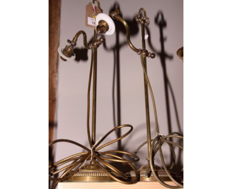 A pair of early 20th Century adjustable brass lamp brackets fitted as table lamps