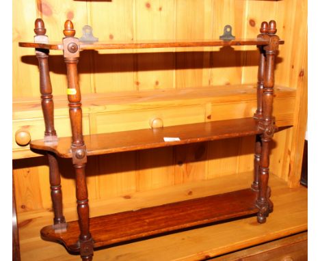 A 19th Century mahogany three-tier open wall shelf, 28" wide