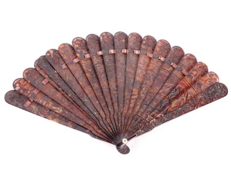 A 19th Century Chinese/Canton carved and pierced tortoiseshell nineteen stick bris? fan (two end guards restored)