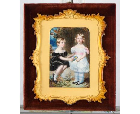An early 19th Century watercolour portrait of two children, one holding a bunch of flowers, in scroll decorated mount and vel
