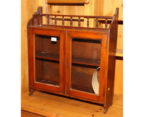 A Victorian wall hung cupboard fitted shelf over