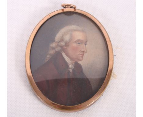 An 18th Century portrait miniature, portrait of a gentleman in red overcoat, Philip Jackson, in gilt copper oval frame