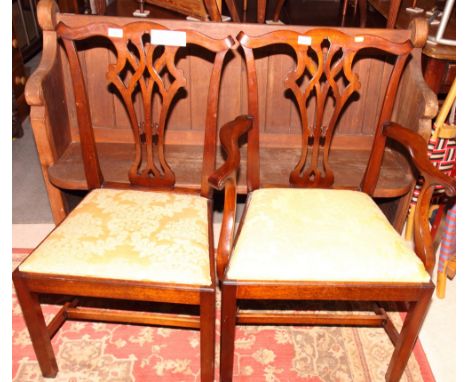 A set of six Chippendale dining chairs with fretted splats and drop-in seats, upholstered in a gold fabric, on square support
